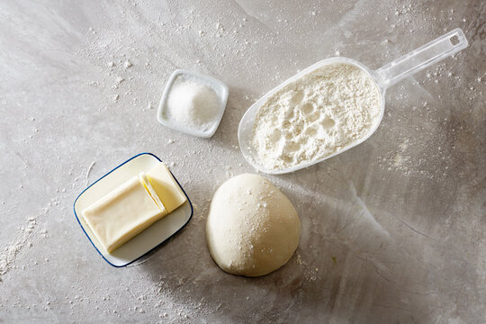 Ingredients for making bread on a marble cutting board