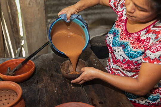 Pouring cacao beverage into a Bowl at Home