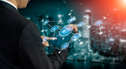 A businessman interacts with digital touchscreen technology, showcasing network icons in a modern...