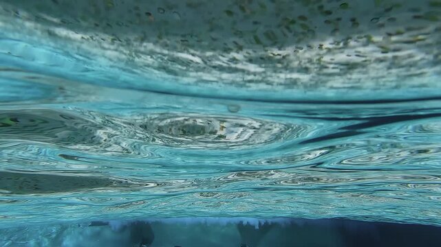 View from underwater out of famous Trevi Fountain a landmark and popular tourist visiting spot in Rome, Italy, slow motion