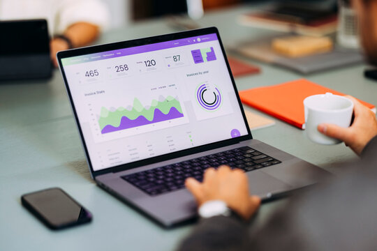 Business Dashboard On Laptop At Modern Office