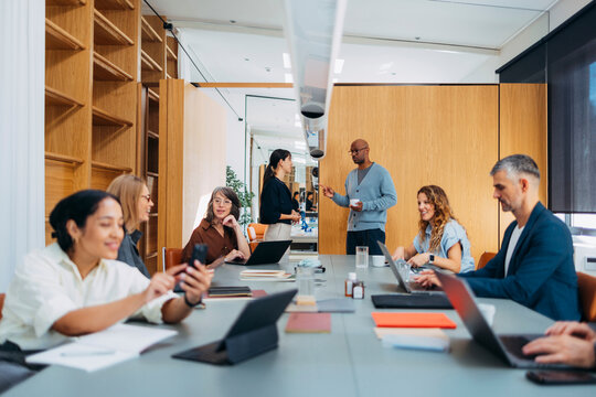 Diverse Team Meeting In Modern Office Conference Room