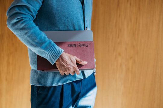 Businessman With Planner And Laptop