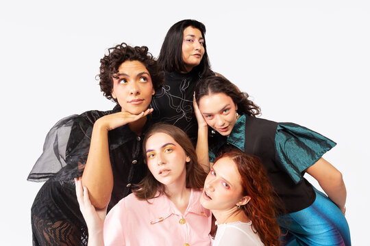 Female friendship portrayed by five women in studio