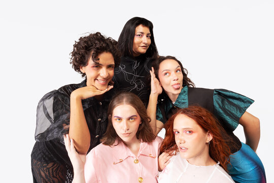 Female friendship portrayed by five women in studio