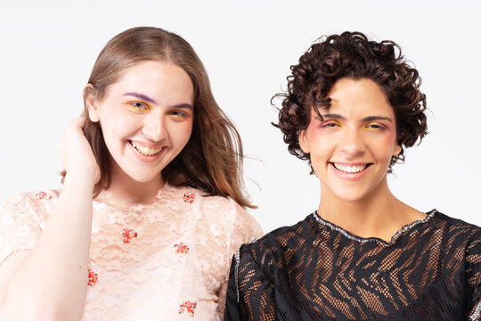 Studio beauty image of two women with bold makeup