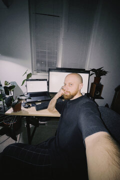 Bald bearded man selfie working home office
