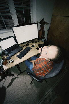 Woman feeling bored working from home at desk