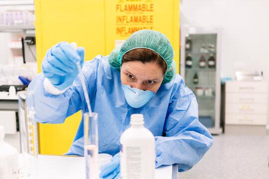Pharmacist preparing medicine in hospital pharmacy laboratory