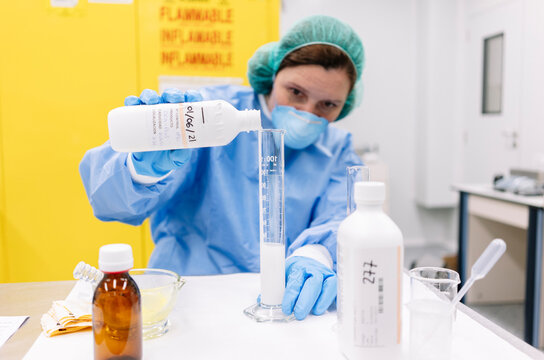 Pharmacist preparing medicine in hospital pharmacy laboratory