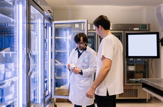 Pharmacists checking medicine stock in hospital pharmacy