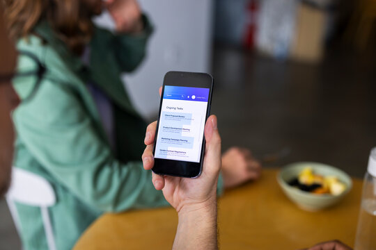 Businessman Checks Phone 