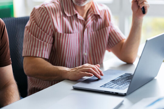 Casual Business Teamwork With Laptop On Desk