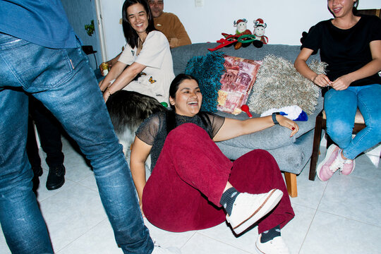 Friends Gather for Fun at Home Party With Laughter and Joy
