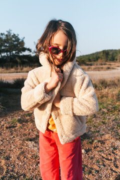 Little girl snuggling into her sherpa jacket 