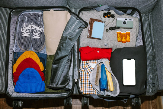 Packing for a trip with clothes and items