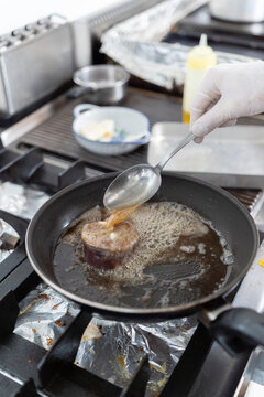 Basting Steak in Hot Pan
