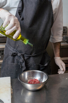Chef Adding Oil
