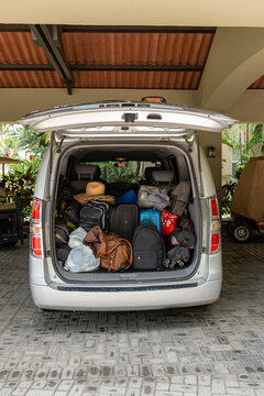 Microbus Trunk Loaded With Suitcases And Backpacks For A Trip