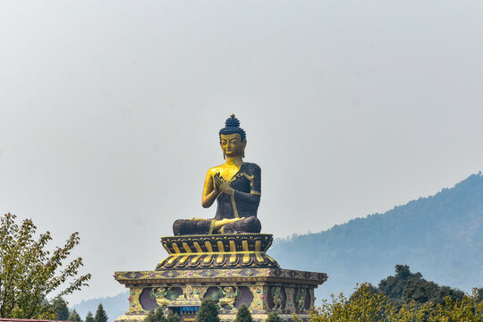 Ravangla buddha park, A majestic Buddha statue on hilltop monastery with scenic mountain backdrop in Sikkim.