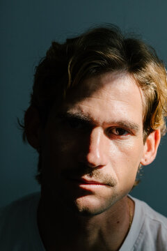 Portrait of man looking at camera with a resolute expression