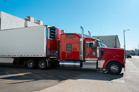 American Semi Truck Parked at Industrial Warehouse
