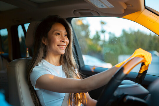 Woman driving in warm light
