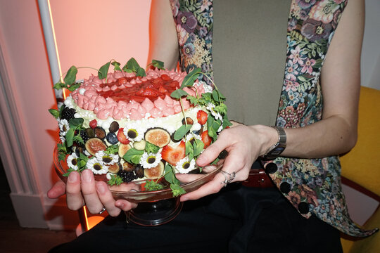Holding a Fun Decorated Cake