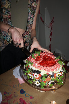 Slicing into a Colorful Decorated Cake 