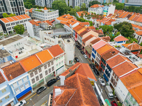 Narrow streets through lines of row houses with colorful tiled roofs
