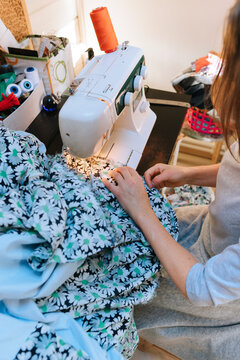 Creative Sewing Session in a Cozy Craft Room Filled With Fabric