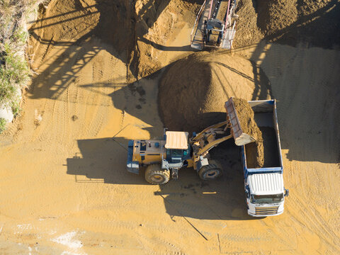 Aerial Loader Filling Truck at Gravel Quarry