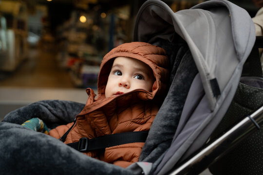 Baby in stroller discovering the urban city street