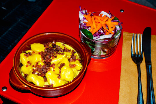 gnocchi in parmigiano reggiano sauce with prosciutto crumbs