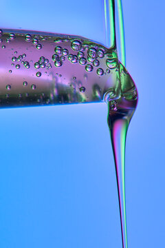 Colorful Liquid Bubbles Flow from a Transparent Medical Tube.