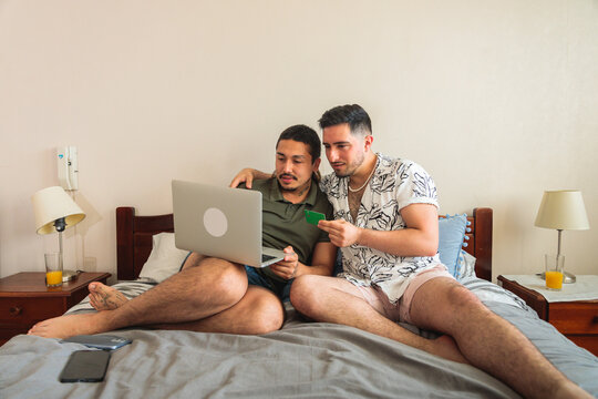 Same Sex Couple Shopping Online With Credit Card