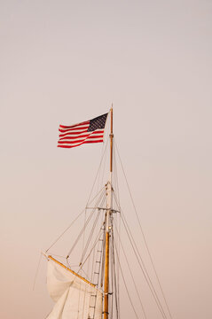 American Flag Flying from Sailboat Mast at Golden Hour