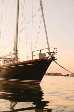 Sailboat Bow at Golden Hour on Calm Water