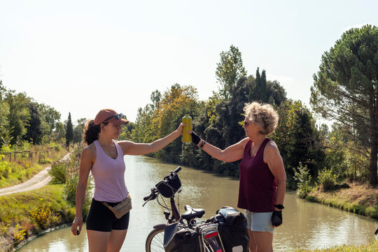Cyclists Passing Water Bottle