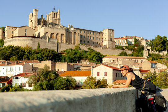 Cyclist Enjoying the View of B&Atilde;&copy;ziers Cathedral