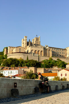 Cyclist Stopping to Admire B&Atilde;&copy;ziers Cathedral