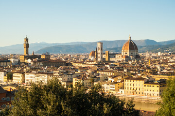 Naklejka premium View of Florence skyline with buildings and mountains during clear day in Italy
