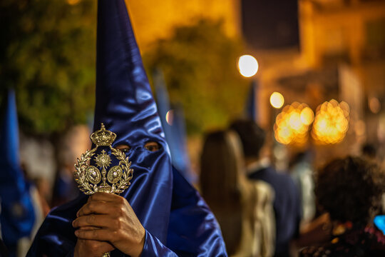 Seville Holy Week: Hiniesta Penitent with Brotherhood Emblem Staff