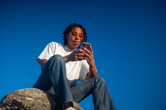 Beautiful black woman with her phone