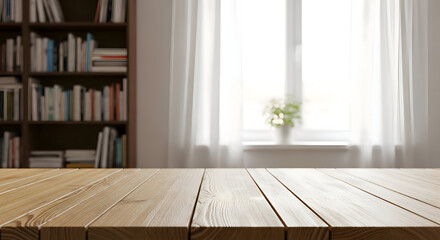 Fototapeta premium Wooden table in foreground with blurred bookshelf and window image photo
