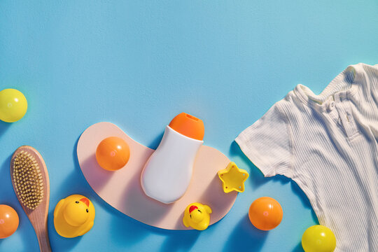 Baby care essentials arranged on a blue background