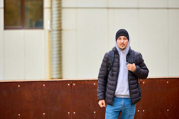 Man stands casually outdoors, dressed warmly © Iurii Gagarin