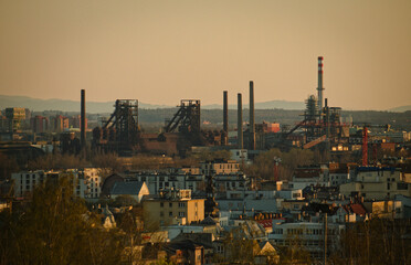 Obraz premium Czech Factories Glow At Dusk. Eerie Hazy Atmosphere Surrounds Rusting Factories And Chimneys