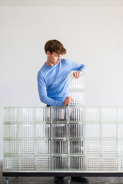 Man Building Glass Block Wall Art Installation
