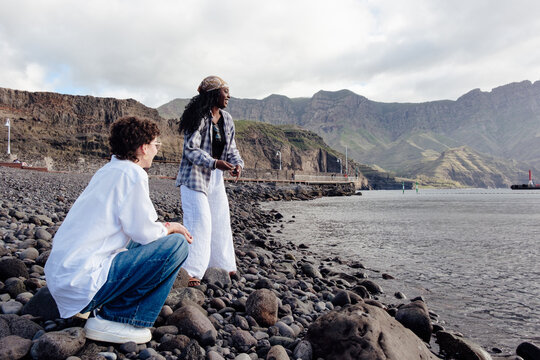 Two friends traveling Gran Canaria experiencing coastline adventure